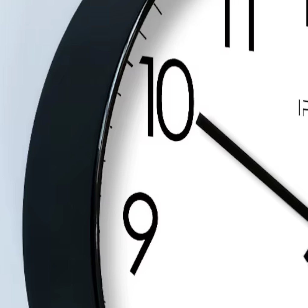 Modern round black wall clock for the living room