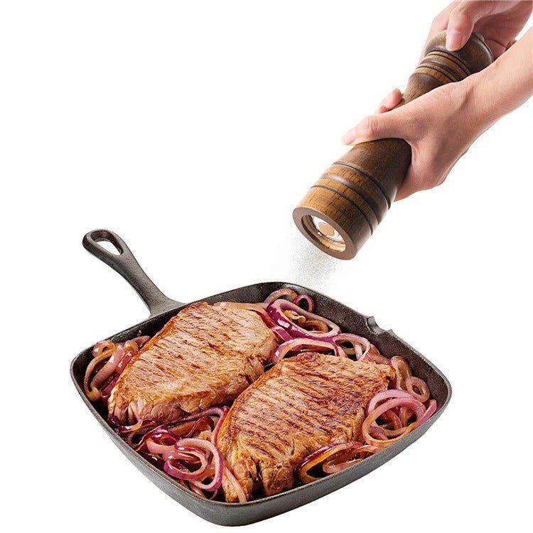 Modern high cylindrical spice grinder for the kitchen